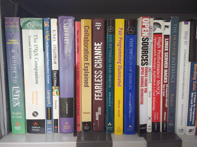 Image of some books on my office bookshelf including Open Sources.