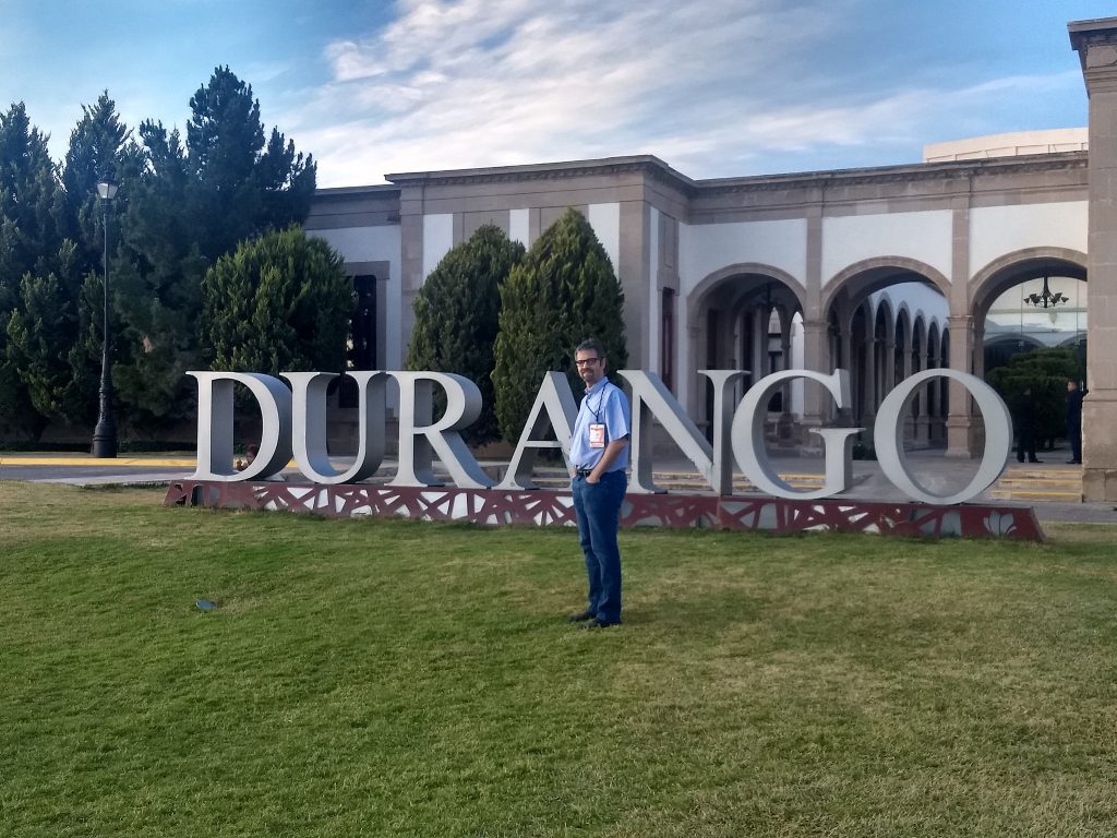 Picture of Ken in front of the "Durango" sign.