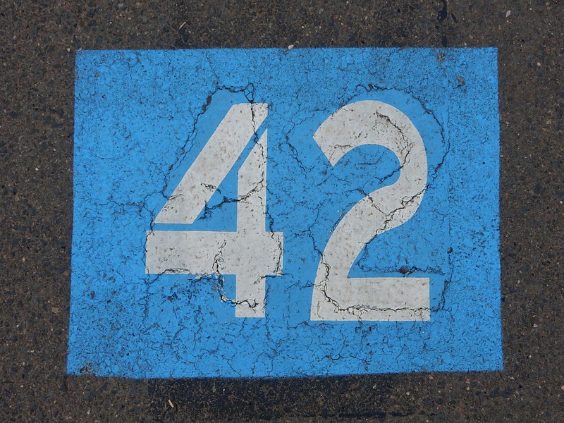 The number 42 in white text on a blue solid background