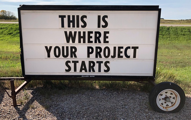 Roadside sign with text "This is where your project starts"