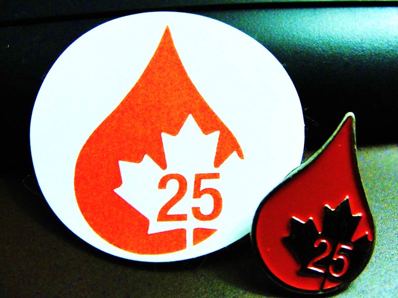 Pin and sticker given for 25th blood donation in Canada.