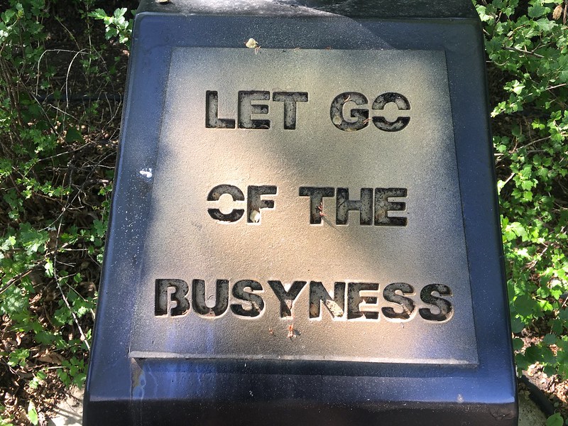 Plaque that reads "Let Go of The Busyness"