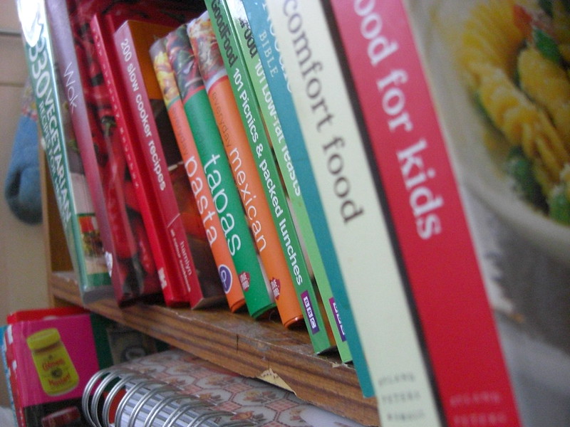 Cookbooks on a shelf.