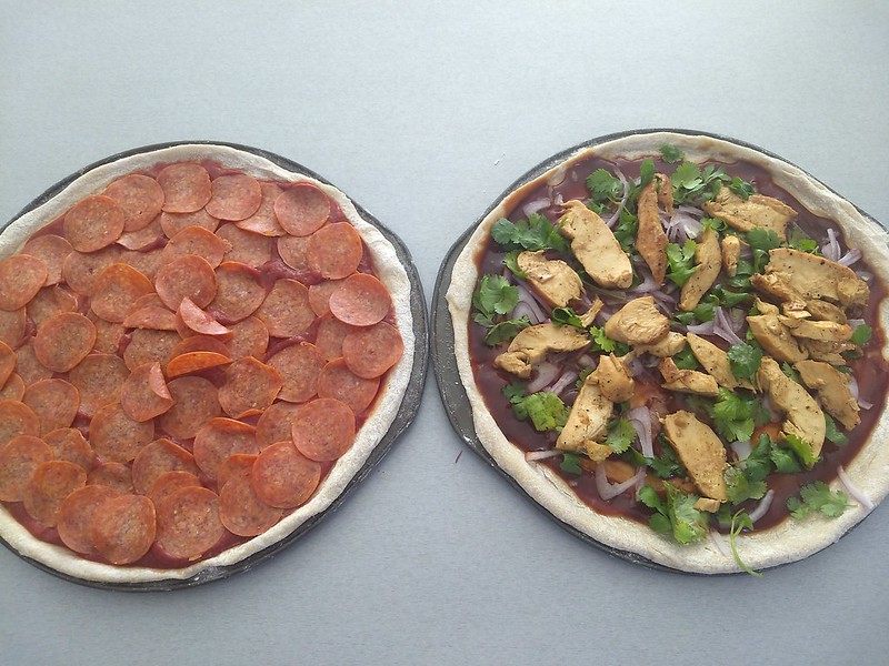 Pepperoni and BBQ Chicken Pizzas before putting cheese on and baking them.