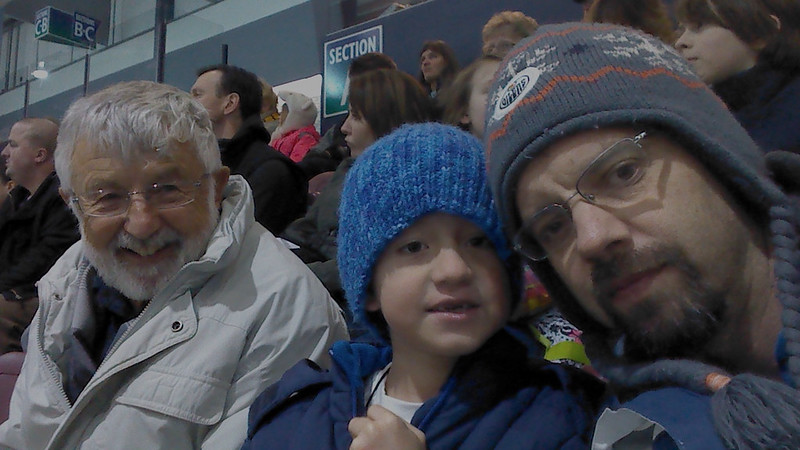 Hockey with Dad and Adrián. At a Victoria Grizzlies hockey game.