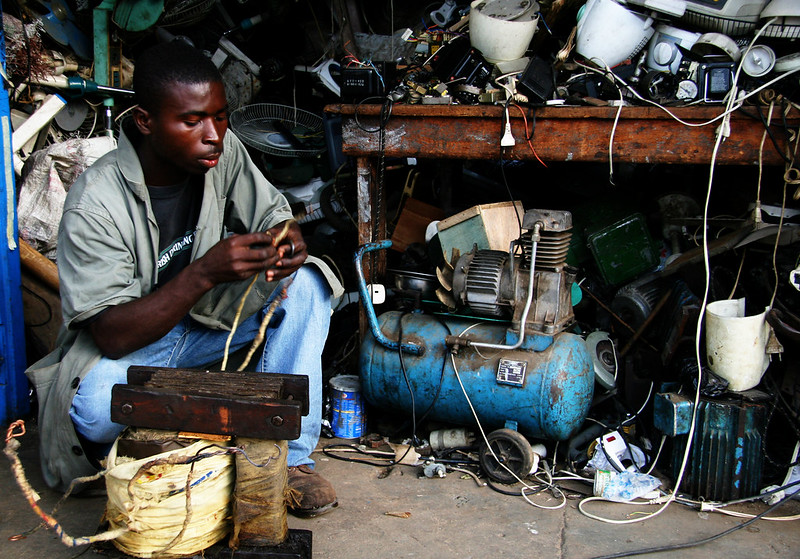 An electrical repairman in his incredibly cluttered shop, Koforidua, Ghana, West Africa
