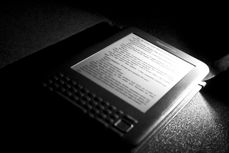 Black and white picture of an Amazon Kindle reader.
