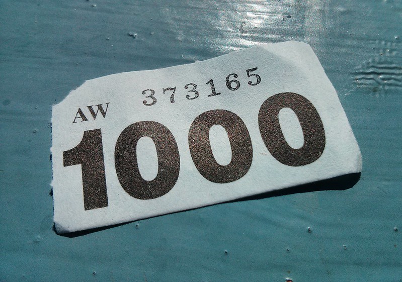 Ticket stub with the number 1000.