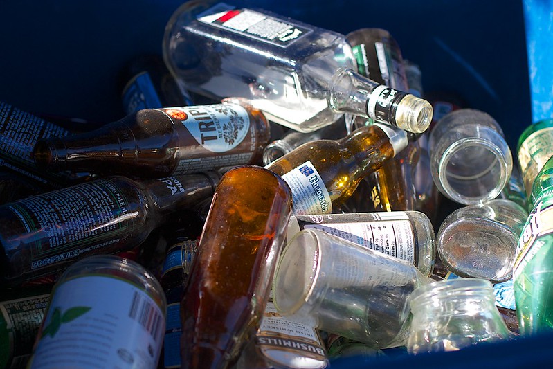 A bin of various bottles and cans ready to take to the recycling depot.